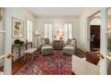 Cozy living room features hardwood floors, neutral furniture, and bright natural light at 74 Hospitality St, Mount Pleasant, SC 29464