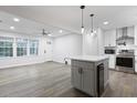 Open-concept kitchen featuring a stylish island, stainless steel appliances, and modern lighting at 1105 Crull Dr, Charleston, SC 29407