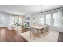 Open-concept living and dining area with abundant natural light and modern decor at 111 Battle Boat Blvd, Summerville, SC 29485