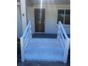 Close-up of the freshly painted front entrance with new stairs and updated railing at 1229 Winston St, Charleston, SC 29407