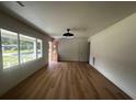 Bright and airy living room featuring wood floors, modern lighting, and large windows at 1229 Winston St, Charleston, SC 29407