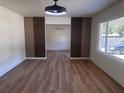 Spacious living area with decorative accent wall, wood floors, and modern lighting at 1229 Winston St, Charleston, SC 29407