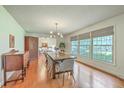 Bright dining room featuring hardwood floors, large windows, and modern furnishings at 133 Axtell Dr, Summerville, SC 29485
