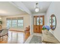 Inviting foyer featuring hardwood floors, wooden table, decorative mirror, and stylish light fixture at 133 Axtell Dr, Summerville, SC 29485