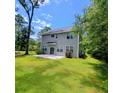 Large, grassy backyard with patio, perfect for outdoor entertaining and relaxation at 133 Pelican Lane, Summerville, SC 29485