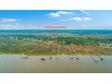Waterfront community view from above with private piers for boating and water activity access at 1343 Headquarters Plantation Dr, Johns Island, SC 29455