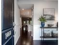 Inviting entryway features dark hardwood floors, wainscoting, and stylish console table at 1460 Oldenburg Dr, Mount Pleasant, SC 29429