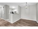 Dining area features modern pendant lighting and an adjacent breakfast bar overlooking the kitchen at 1600 Long Grove Dr # 423, Mount Pleasant, SC 29464