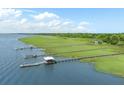 Breathtaking aerial view of waterfront property featuring multiple private docks and expansive green space at 2026 Sea Water Dr, Charleston, SC 29412