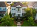 Stunning exterior view of a two-story home with a charming porch and vibrant green shutters at 206 White Gables Dr, Summerville, SC 29483