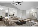 Bright living room features wood floors, a modern ceiling fan, and an open floor plan at 207 Thomaston Ave, Summerville, SC 29485