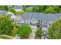 An aerial view of a well-maintained home, lush landscaping, and convenient two-car garage at 3012 Candela Grove Dr, Charleston, SC 29414