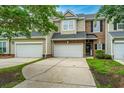 Charming townhomes with attached garages and well-maintained driveways, offering both convenience and curb appeal at 3012 Candela Grove Dr, Charleston, SC 29414