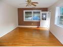 Bright living area with hardwood floors, fresh paint, a ceiling fan, and natural light at 3034 Maybank Hwy, Johns Island, SC 29455