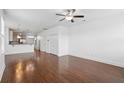 Spacious living room with modern flooring, bright lighting, and a seamless open-concept design at 3927 Four Poles Park Dr, North Charleston, SC 29405