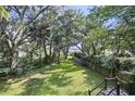 Spacious backyard with lush greenery, mature trees, and serene views of the property at 4601 Apple St, North Charleston, SC 29405