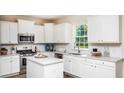 Well-lit kitchen featuring white cabinets, stainless steel appliances, and subway tile backsplash at 547 Verdi Drive Dr, Summerville, SC 29486