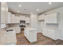Beautiful white kitchen with stainless steel appliances and an island at 547 Verdi Drive Dr, Summerville, SC 29486