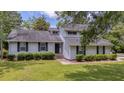 Charming two-story home with manicured lawn and inviting facade, located at 600 at 600 Dolphin Dr, Summerville, SC 29485