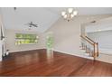 Spacious living room with hardwood floors, fireplace, and natural light from large window at 633 Alwyn Blvd, Summerville, SC 29485