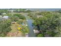 Aerial view showing a lovely home site next to a canal, dock, and marsh views at 689 Port Cir, Charleston, SC 29412