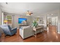 Spacious living room with hardwood floors, modern furniture, and plenty of natural light at 7030 Billberry St, Hanahan, SC 29410