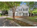 Charming two-story home nestled among mature trees, offering curb appeal at 800 Heyward Cove Pl, Charleston, SC 29412