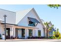 A lovely exterior view of the community's wellness center, with its modern farmhouse style and inviting entrance at 87 French Garden Cir, Summerville, SC 29486
