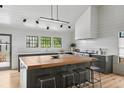 Modern kitchen features a large island with seating, stainless steel appliances, and ample counter space at 922 Kincade Dr, Mount Pleasant, SC 29464