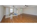 Spacious bonus room featuring hardwood floors, two ceiling fans and 2 closets at 9305 Sweetbay Ct, Ladson, SC 29456