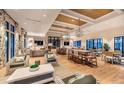Sophisticated lounge area with stylish decor, comfortable seating, hardwood floors, and designer lighting at 99 French Garden Cir, Summerville, SC 29486