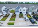Aerial view of colorful townhomes, showing driveways, landscaping, and neighborhood layout at 108 Rosefield Ct, Summerville, SC 29485