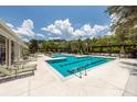 Large outdoor pool area featuring lounge chairs, umbrellas, and clear blue water for residents to enjoy at 1121 Basildon Rd, Mount Pleasant, SC 29466
