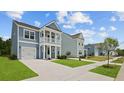 Street view of new construction two-story homes with well-maintained landscaping at 116 Midmills Ln, Summerville, SC 29486