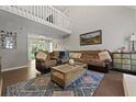 Inviting living room with cathedral ceilings, a comfortable sectional, and a stylish coffee table at 125 Crooked Creek Ct, Summerville, SC 29486