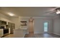 Modern kitchen featuring stainless steel appliances, white cabinets, and plank flooring at 1300 Park West Blvd # 519, Mount Pleasant, SC 29466
