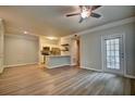 Open living space with plank flooring, modern fixtures, and a door to the outside at 1300 Park West Blvd # 519, Mount Pleasant, SC 29466