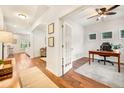 Bright home interior showcases hardwood floors, an office with french doors, and an archway to a living space at 1309 Belgian Draft Dr, Mount Pleasant, SC 29466