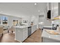 Bright eat-in kitchen with long countertops and modern stainless appliances at 138 Brown Swiss Cir, Summerville, SC 29483