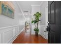 Inviting foyer with wood floors and decorative accents at 2064 Promenade Ct, Mount Pleasant, SC 29466
