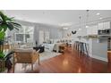 Open-concept living area with hardwood floors and natural light at 2064 Promenade Ct, Mount Pleasant, SC 29466