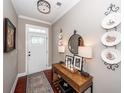 Tastefully decorated foyer with dark wood floors, stylish console table, and decorative wall accents at 2632 Alderly Ln, Mount Pleasant, SC 29466
