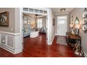 Open-concept living room with hardwood floors, cozy seating, and great natural light at 2632 Alderly Ln, Mount Pleasant, SC 29466