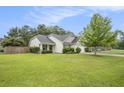Home featuring a well-manicured front lawn at 341 Drayton Place Drive Dr, Moncks Corner, SC 29461