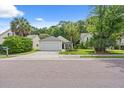 A cozy single-Gathering home featuring an attached two-car garage and manicured front lawn at 3486 Ashwycke St, Mount Pleasant, SC 29466