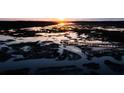 Scenic sunset aerial view of coastal marsh with winding waterways and natural landscape at 3901 Summerton St, Mount Pleasant, SC 29466