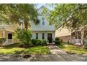 Charming home featuring lush landscaping, a welcoming entryway at 417 Verbena Ave, Summerville, SC 29483