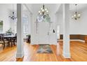 Elegant foyer with high ceilings, hardwood floors, and a chandelier, creating a grand entrance at 4209 Wildwood Lndg, Charleston, SC 29420