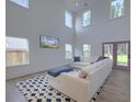 Bright living room with vaulted ceilings, ample natural light, comfortable seating, and stylish décor at 4374 Cotton Flat Rd, Summerville, SC 29485