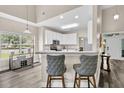 Inviting kitchen featuring white cabinetry, a breakfast bar, and modern appliances with a neutral color palette at 5013 Franconia Dr, Summerville, SC 29485